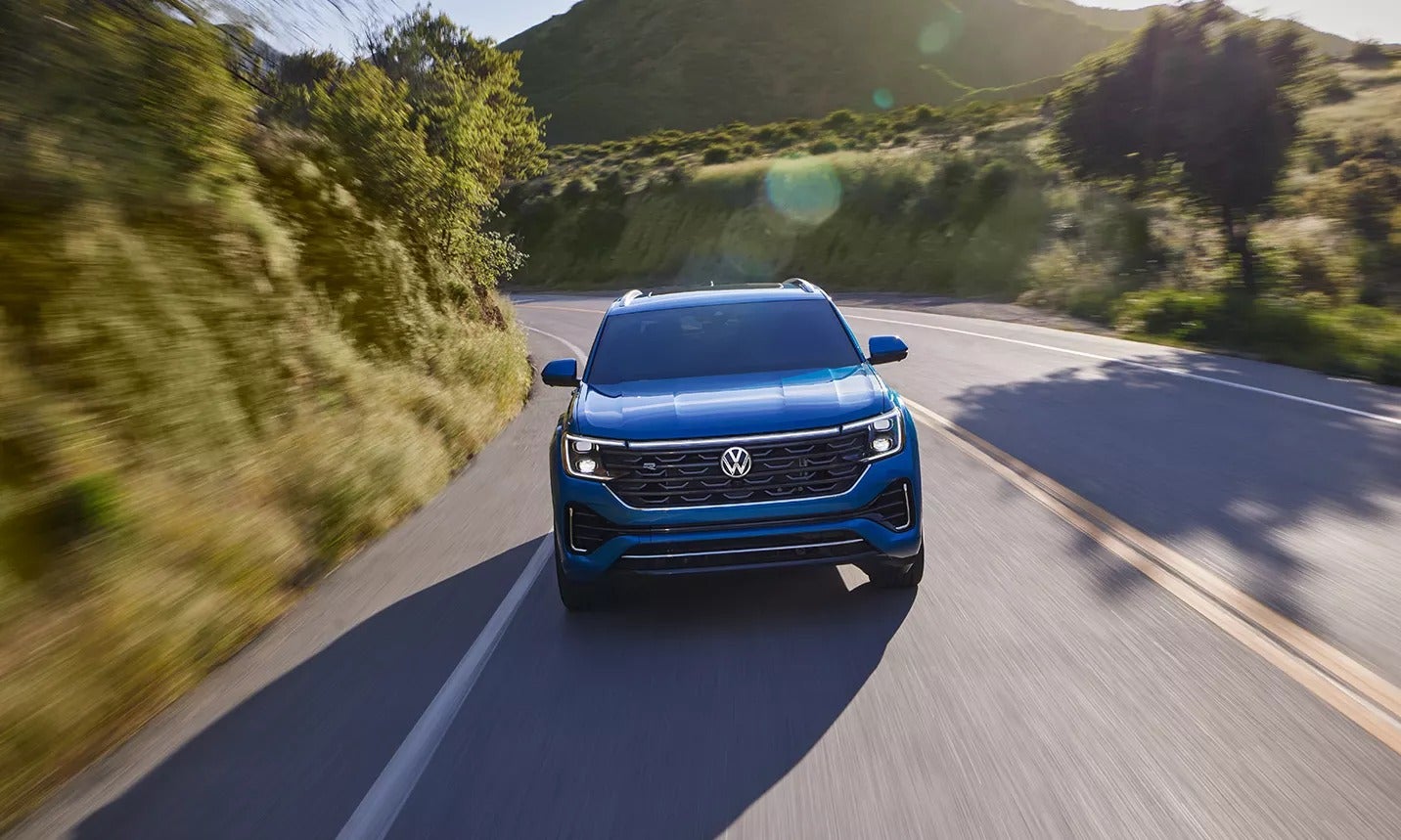 2024 Volkswagen Atlas Cross Sport driving on a road