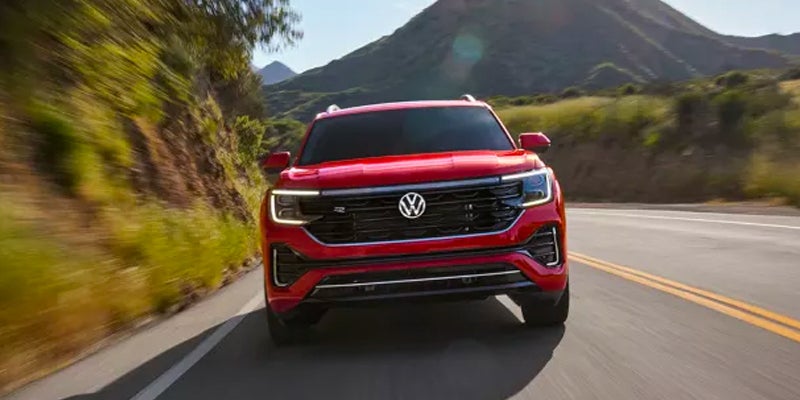 2024 Volkswagen Atlas driving on asphalt